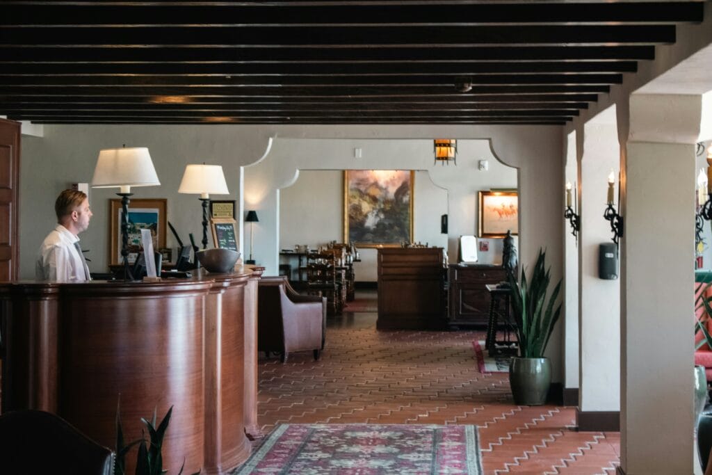 Hotel lobby with reception desk and staff